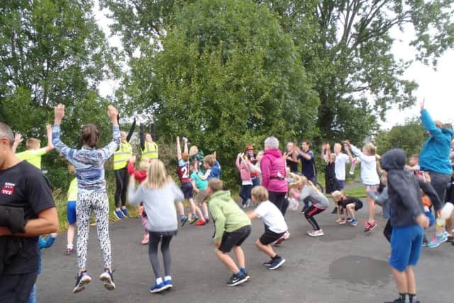 Some of the young runners limber up ready to tackle the first ever Padiham Greenway junior parkrun