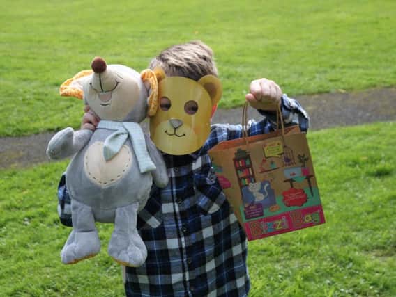 A delighted youngster and his cuddly friend prepare for the Teddy Bears picnic at Padiham's Party in the Park (Photo Howard Hudson)