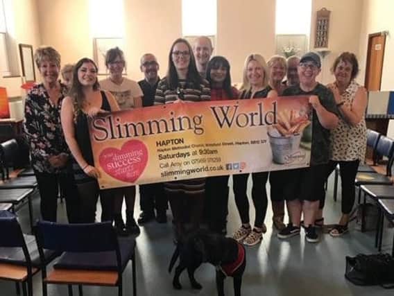 Members of Hapton Slimming World are celebrating members losing 150 stone in just one year with their leader Amy Marsters in the centre.