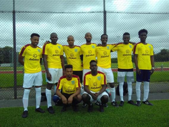 The refugee team in Crewe sporting their new Burnley FC shirts.