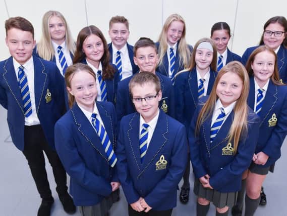Some of the students at Burnley's Blessed Trinity RC College who see their parents both at home and school.
