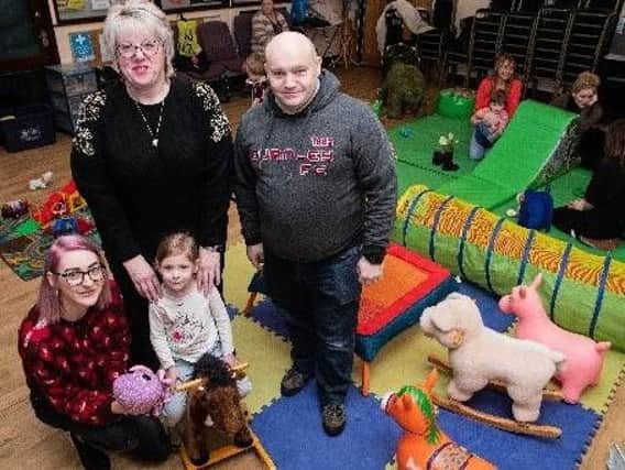 Burnley Wood Centre manager Karen Heseltine (back) with trustee Russ Neal and Sasha Smith and her daughter Daisy Hindle (three) taken earlier this year at the weekly playgroup.