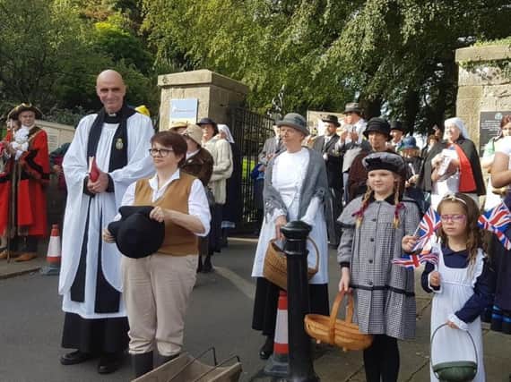 The Rev. Andy Froud with the procession at the Clitheroe Castle Gates
