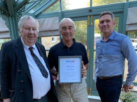 Stan Ternent receives his award from Peter Pike and Liam Hallinan