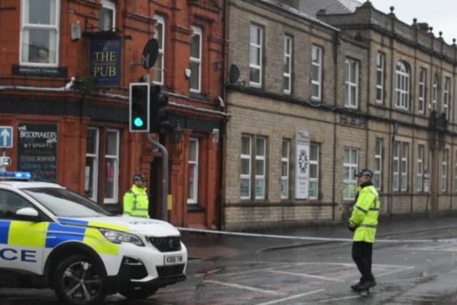 Police man the cordon in place in Yorkshire Street, Burnley after the bomb scare this afternoon.