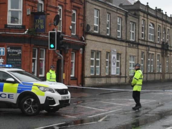 Police man the cordon in place in Yorkshire Street, Burnley after the bomb scare this afternoon.