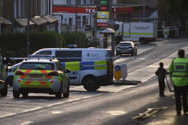 The dramatic scene last night close to the Texaco petrol station in Burnley Road, Padiham, where a suspicious device was found attached to a cash dispensing machine.