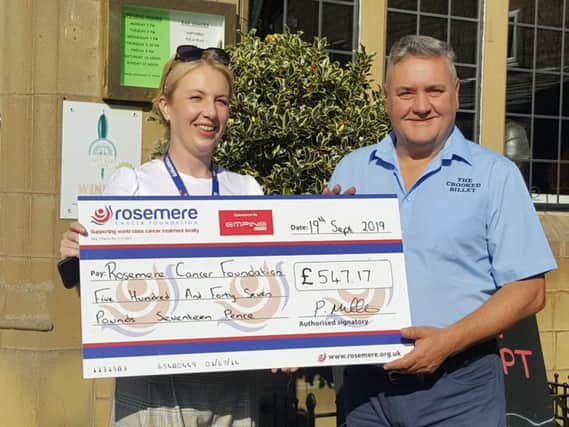 Paul presents a cheque for the Rosemere Foundation