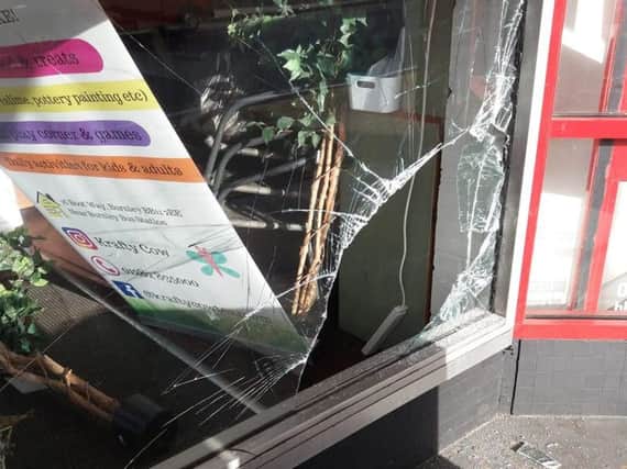 The smashed in window at Krafty Cow tea room