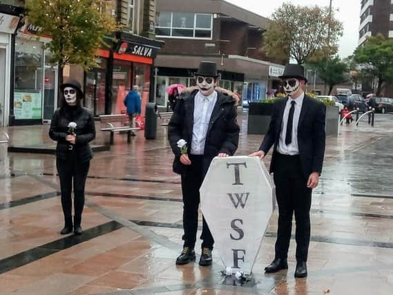 Thomas Whitham students performing a mock 'funeral' for the sixth form in Burnley town centre