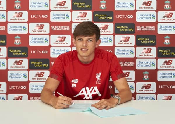 Leighton Clarkson signs his pro contract at The Academy, 01/07/19.

Photo: Nick Taylor/LFC