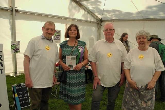 Burnley Mining Memorial Fund committee members Phil Glover (far left), Jack Nadin (second from right), and Elsie Manning (far right) with Julie Cooper MP.