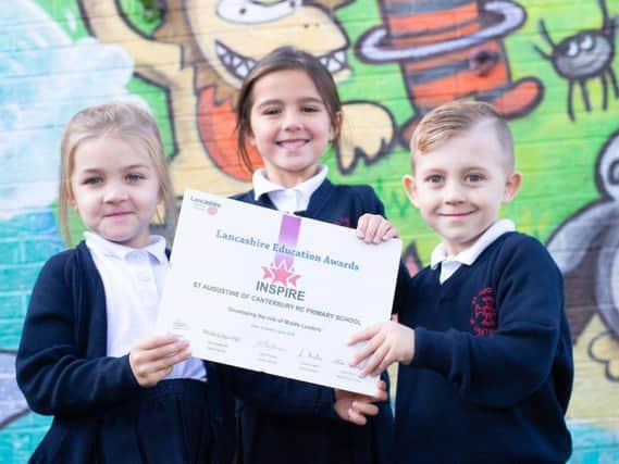 Pupils from St Augustine's RC Primary School proudly display their Inspire Award. (Photo by Andy Ford)
