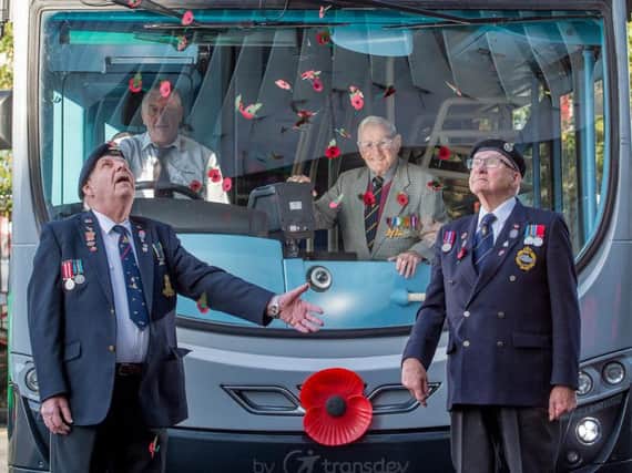 The Burnley Bus Companys parent Transdev is adorning 200 of its buses across the North with large poppies.
