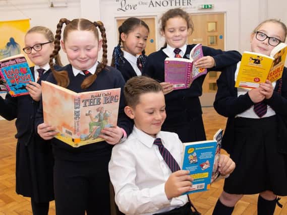 Pupils at St Augustine's RC Primary School in Burnley get stuck into their favourite books as part of the Fantastic Book Award scheme (Photo by Andy Ford)