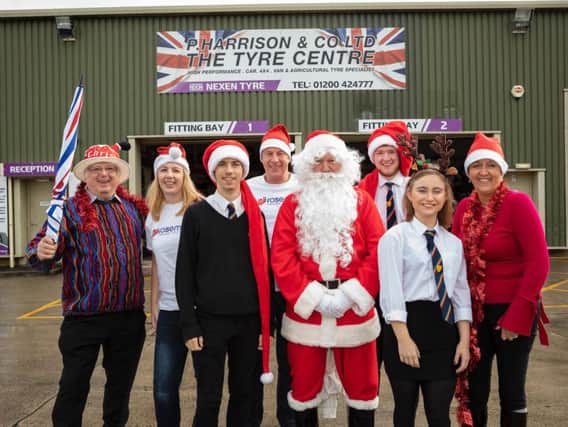 Rosemere Cancer Foundation supporters from the left Roger Wilson, Louise Grant, Alex Towers, Paul Kavanagh, Father Christmas, Cameron McGregor, Lauren Mealing andSuzanne Taylor, of Eric Wright Group, at the unveiling of plans for this years fundraising Clitheroe Santa Dash