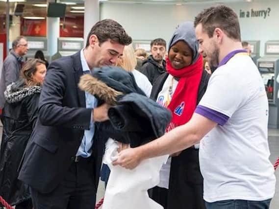 Mayor of Greater Manchester, Andy Burnham donates a coat