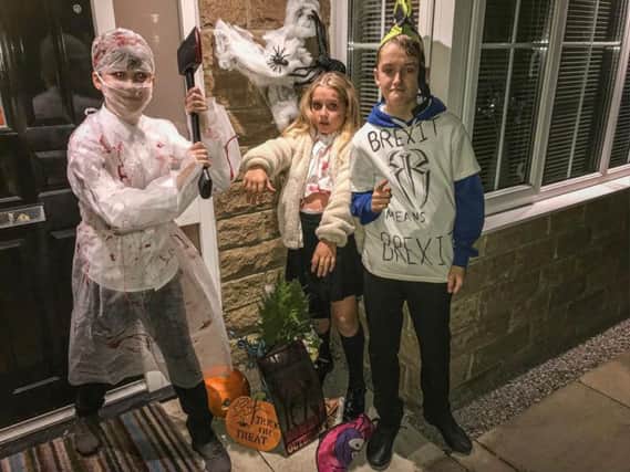 This scary trio are (from left to right) Robbie Dixon as the Scary Surgeon, Isobel Parker as a dead schoolgirl and Dylan Parker as Brexit Boris.