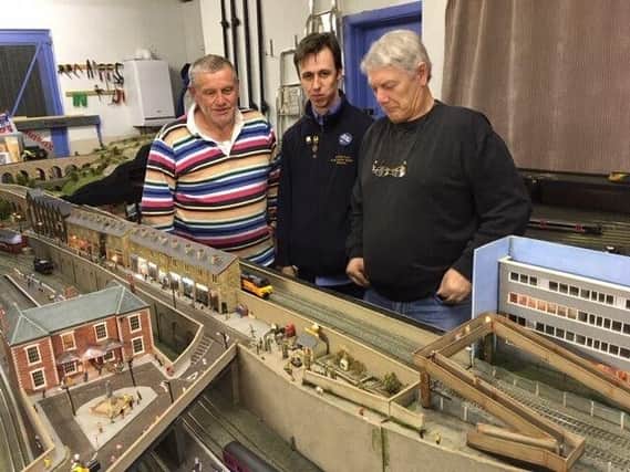 Society members John Dodds, Anthony Ward, and Peter Wainman test running Ecclesford Junction for the exhibition.