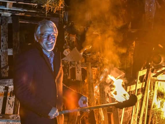 Coun. Ivor Emo lighting the Burnley Community Bonfire in Towneley Park. Pic: Lewis Welch