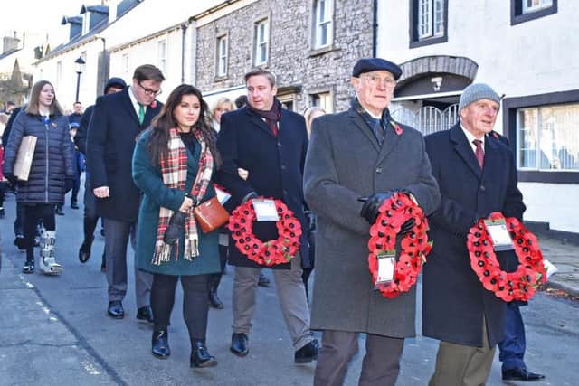Clitheroe residents remember the fallen soldiers. Picture by Ken Geddes