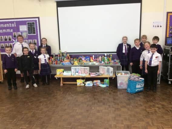 The pupils and the donated goods