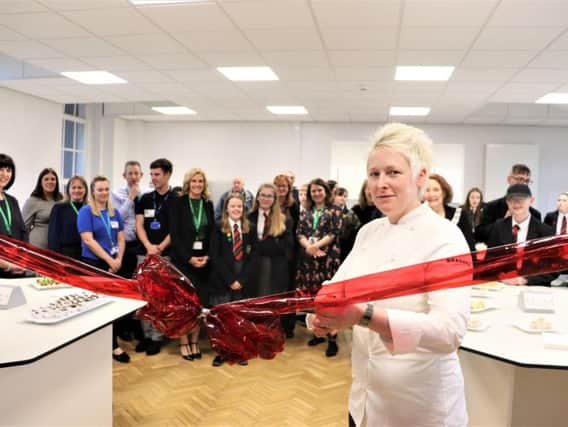Top chef Lisa Goodwin-Allen cuts the ribbon to declare the food tech room open