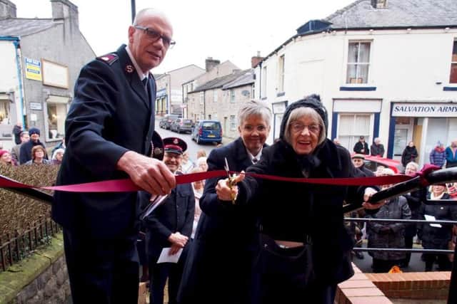 Commissioner Anthony Cotterill and May Wright cut the ribbon