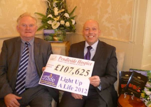 TOTAL:  John Horan (left) and Stephen Alderson of Alderson and Horan Funeral Services,  main sponsors of the hospice Light up a Life campaign (S)