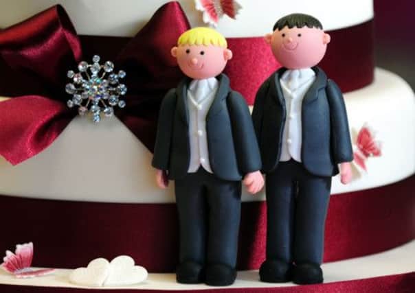 General view of groom cake decorations on a wedding cake . PRESS ASSOCIATION Photo. Picture date: Tuesday February 5, 2013. Culture Secretary Maria Miller has insisted that there is "clear support" from within the Conservative Party for gay marriage as David Cameron faces being deserted by more than half of his MPs over the highly-charged issue. See PA story POLITICS Gay. Photo credit should read: Rui Vieira/PA Wire