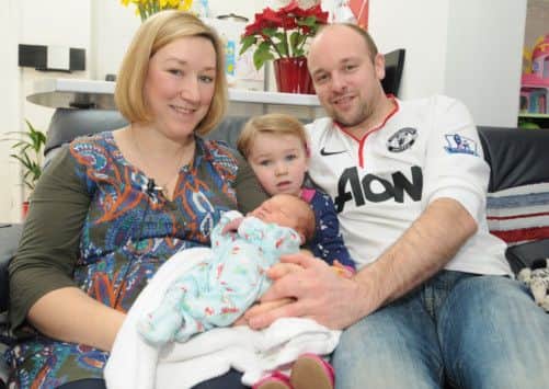 Carolyn Mashiter with her husband Michael, daughter Lucy (2) and baby Joshua who was born on the way to hospital.