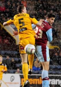 BURNLEY V HULL CITY: Austin challenges with Chester.
Photo Ben Parsons