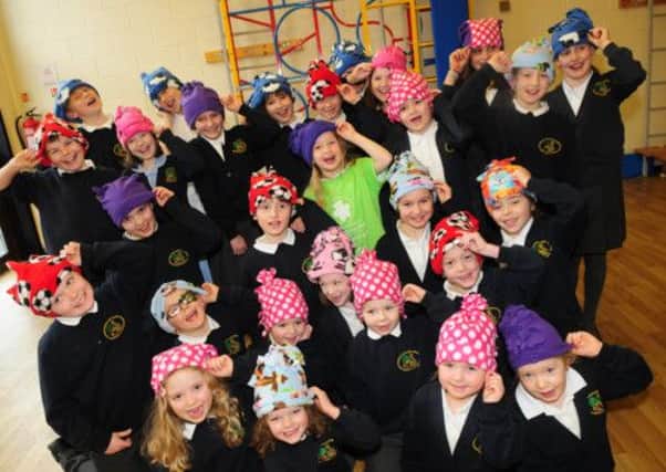 Pupils at Gisburn Primary School wear hats made by pupil Libby Smith in aid of CLIC Sargent.
Photo Ben Parsons