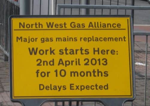 Manchester Road gas main work warning sign.
