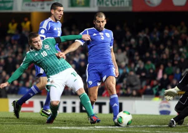 Northern Ireland's Martin Patterson (left) battles with Israel's Tal Ben Haim during the FIFA World Cup Qualifying, Group F match at Windsor Park, Belfast.