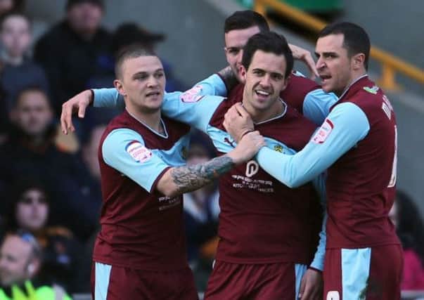 Burnley's Danny Ings is congratulated by team mates after scoring the opening goal