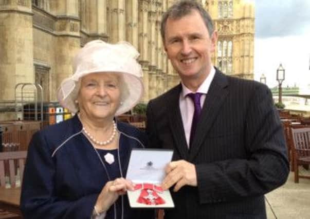 HONOURED: Joyce Holgate MBE with Ribble Valley MP Nigel Evans outside the Houses of Parliament. (s)