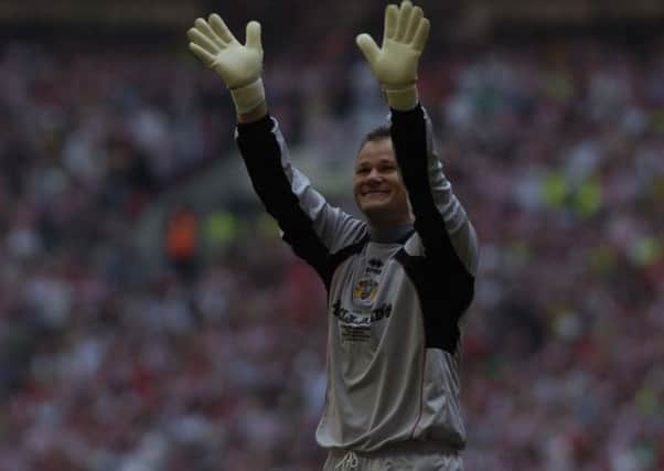Winning promotion at Wembley was the high for big Danish keeper