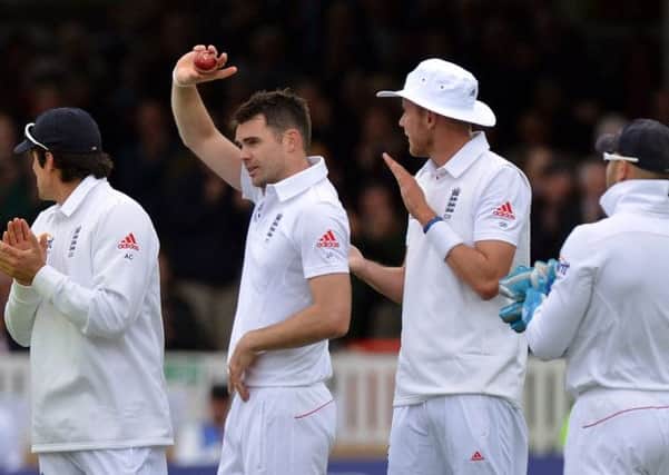 MILESTONE: Burnleys Jimmy Anderson salutes the Lords crowd after claiming his 300th Test wicket for England.