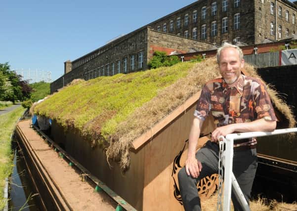 Creative collaborator, Paul Hartley of In-Situ arts organisation is pictured on Leeds Liverpool Canal in Brierfield with The Ark.