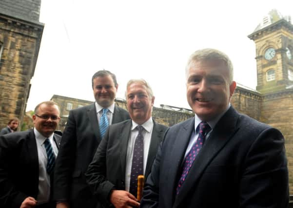 Government for Housing and Local Growth Mark Prisk with Coun. Joe Cooney, Pendle MP Andrew Stephenson and Tim Webber during his visit to Brierfield Mill.