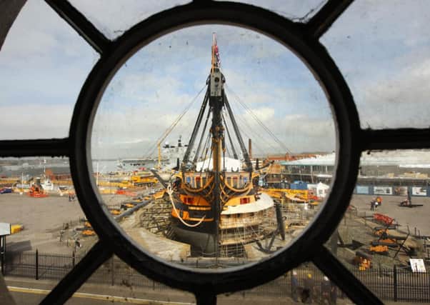 Admiral Lord Nelson's famous flagship HMS Victory stands minus her top-masts and bow-sprit at the Royal Navy Dockyard in Portsmouth. Photo: Chris Ison/PA Wire