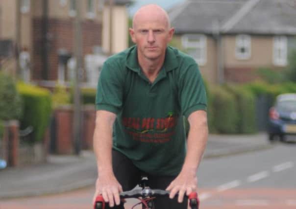 Lee Pinder preparing for his Lands End to John O'Groats bike ride in aid of the Meningitis Trust.