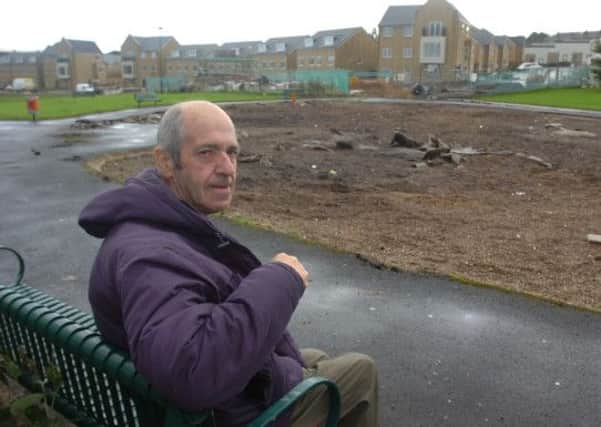 Michael Mobey is pictured in what used to be Burnley Wood play area. The new equipment has been taken away to make way for more new housing.