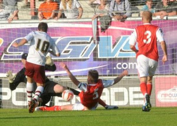 CHANCE: A first half shot from Danny Ings hits the legs of Morecambe keeper Barry Roche.