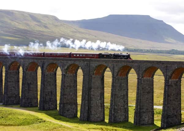 The Waverley steam train crosses the Ribblehead viaduct just over the border from Cumbria into North Yorkshire, on the Settle-Carlisle Railway.Photo credit: Peter Byrne/PA Wire