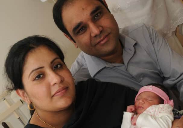 Baby Urwa pictured with parents, Faeena and Raza Hussain.