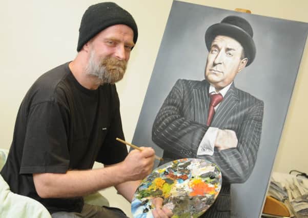 Burnley artist, David Priestley, with the portrait of David Fishwick that will be exhibited.