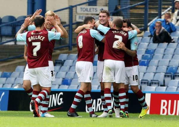BIG GOAL: Sam Vokes is mobbed by his teammates after heading Burnley into a 2-0 lead at Sheffield Wednesday on Saturday