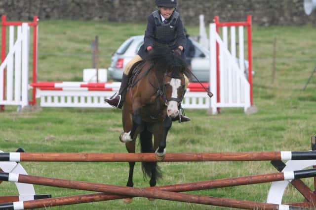Show jumping action at Trawden Show.
